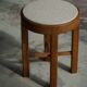 Mid-century Danish stool in oak, reupholstered in boucle wool, circa 1950.