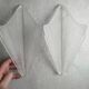 Pair of Art Deco wall sconces in frosted pressed glass.