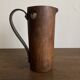 Mountain pitcher in monoxile wood and leather folk art