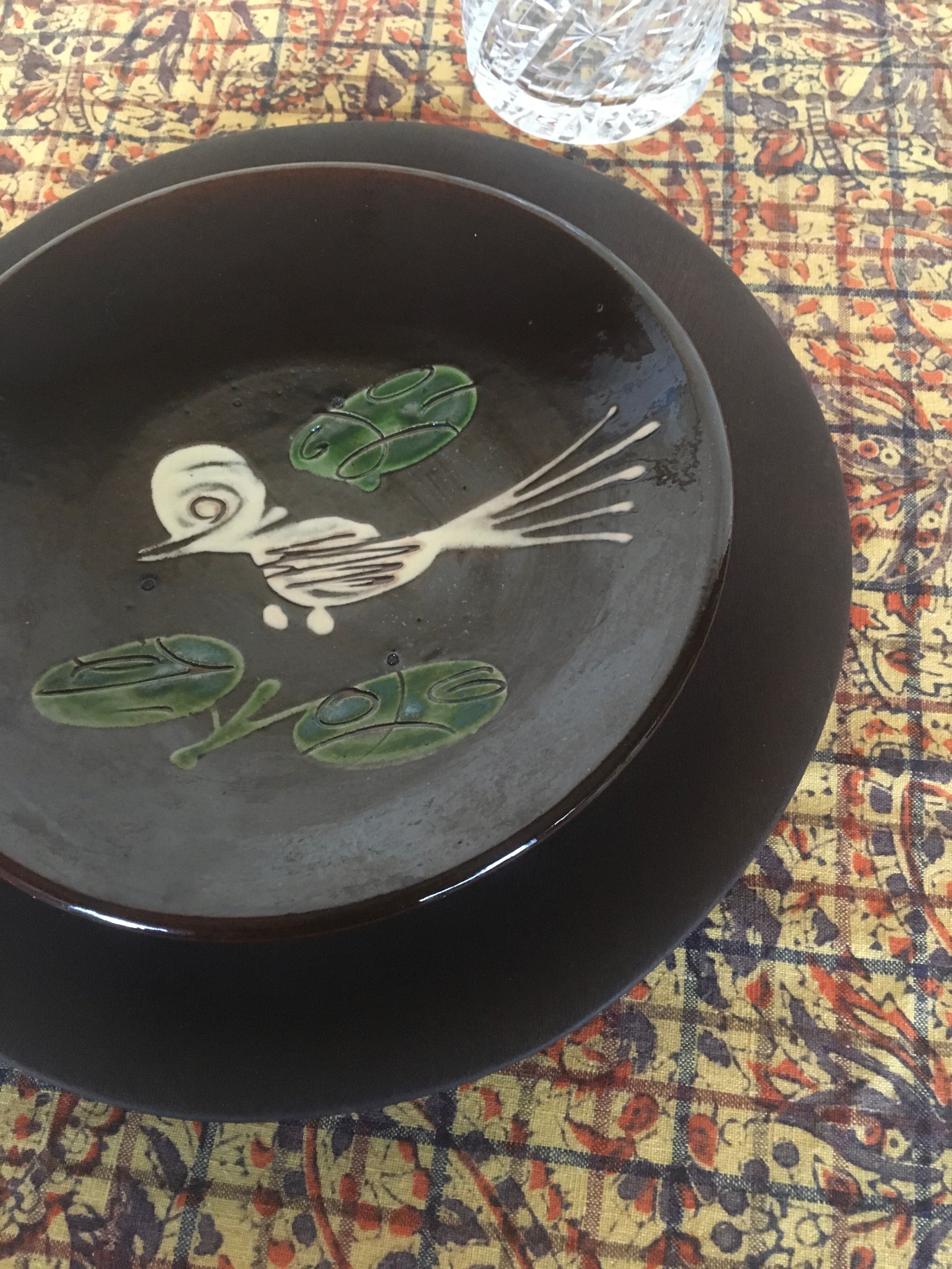 Four decorated ceramic plates