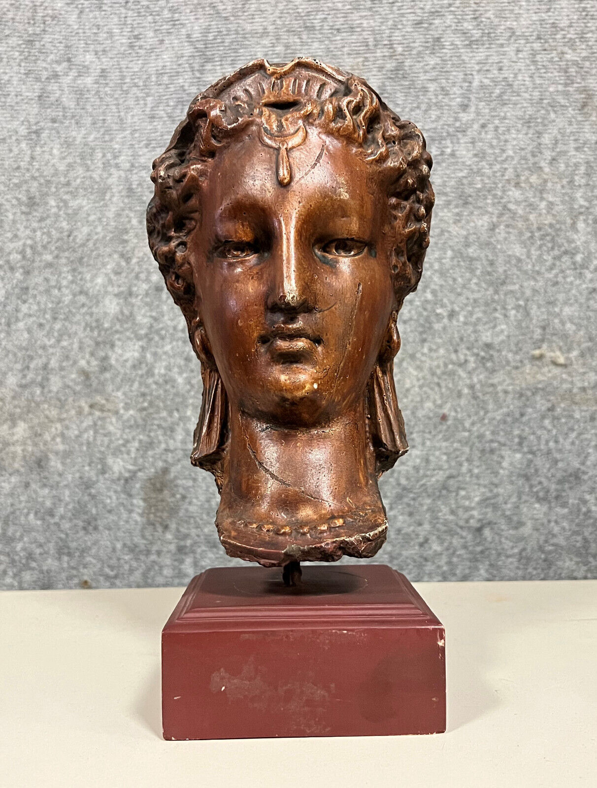 Diane de Poitiers stone bust on a terrace in false pretense of marble