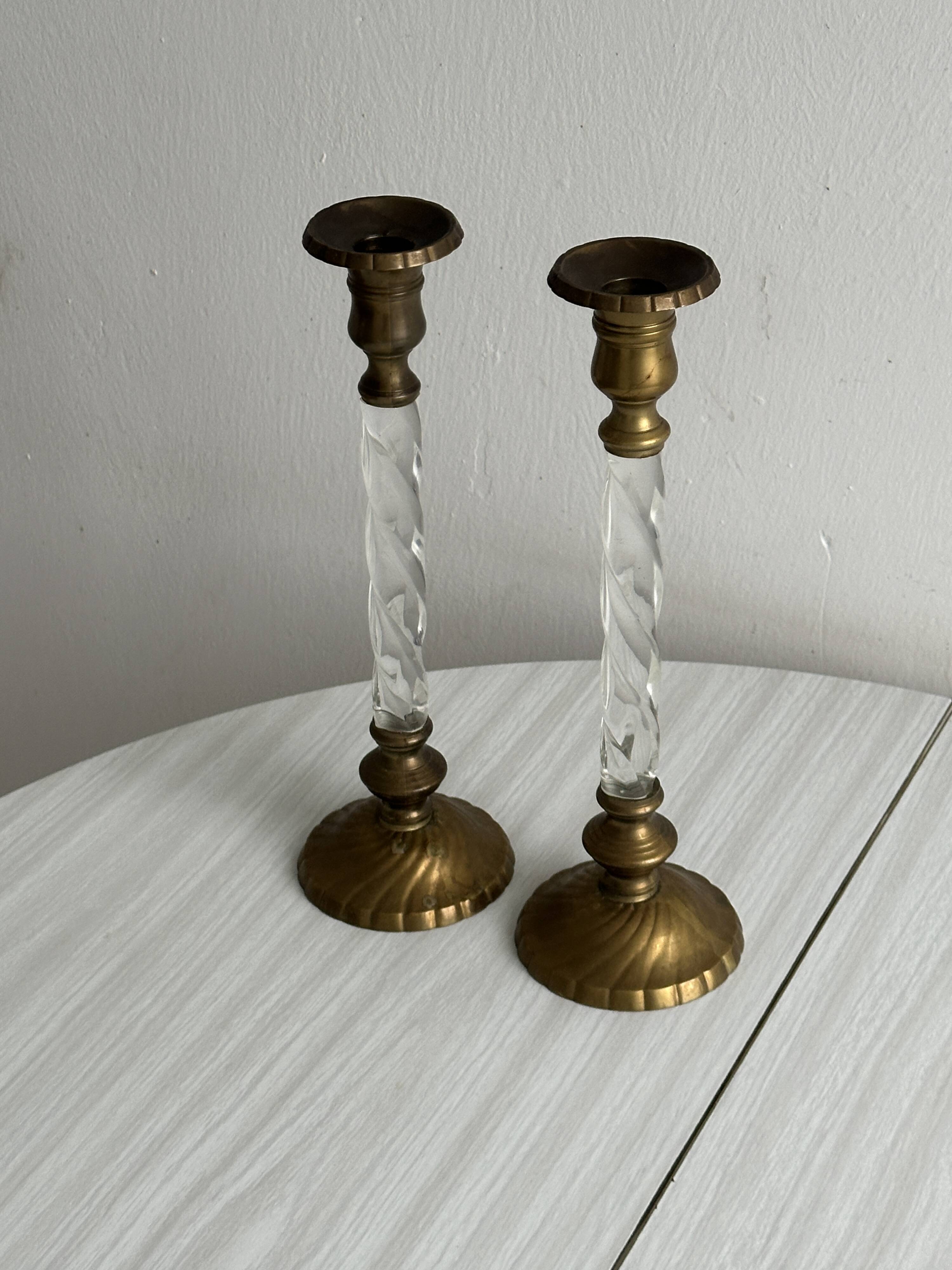 Pair of twisted metal and glass candlesticks