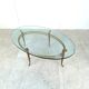 Vintage golden metal and oval glass coffee table, 1970s