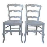 A pair of reimagined country-style chairs in pearl grey.