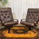 Pair of Norwegian swivel armchairs in leather and beech from the 1970s.
