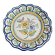 Large hand-painted French faience plate with floral decoration in folk art style.