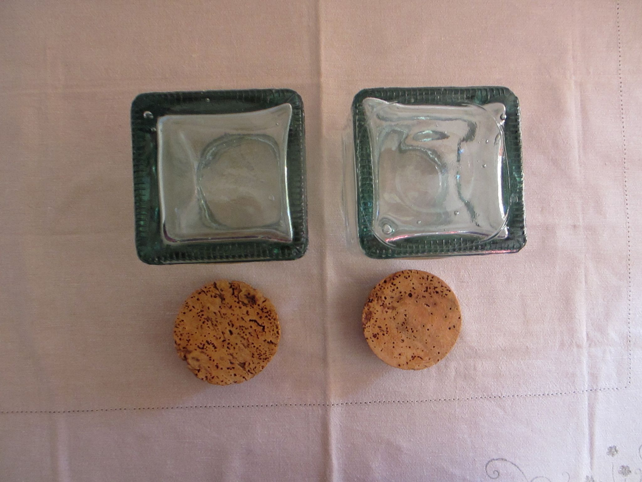 2 glass jars with crusted cork stopper