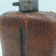 Silver-plated metal flask with leather and glass