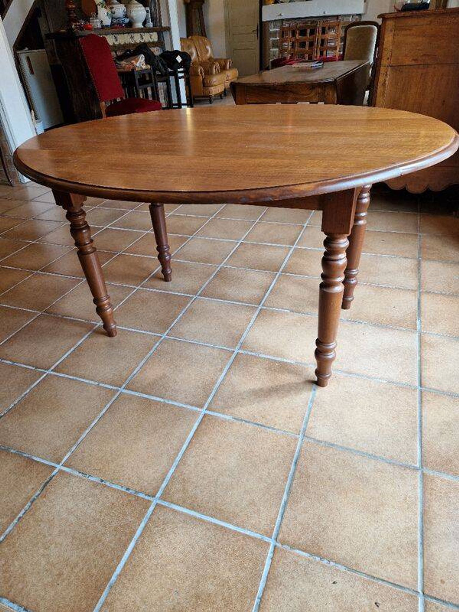 Beautiful oval wooden table with turned wooden leg with 3 extensions