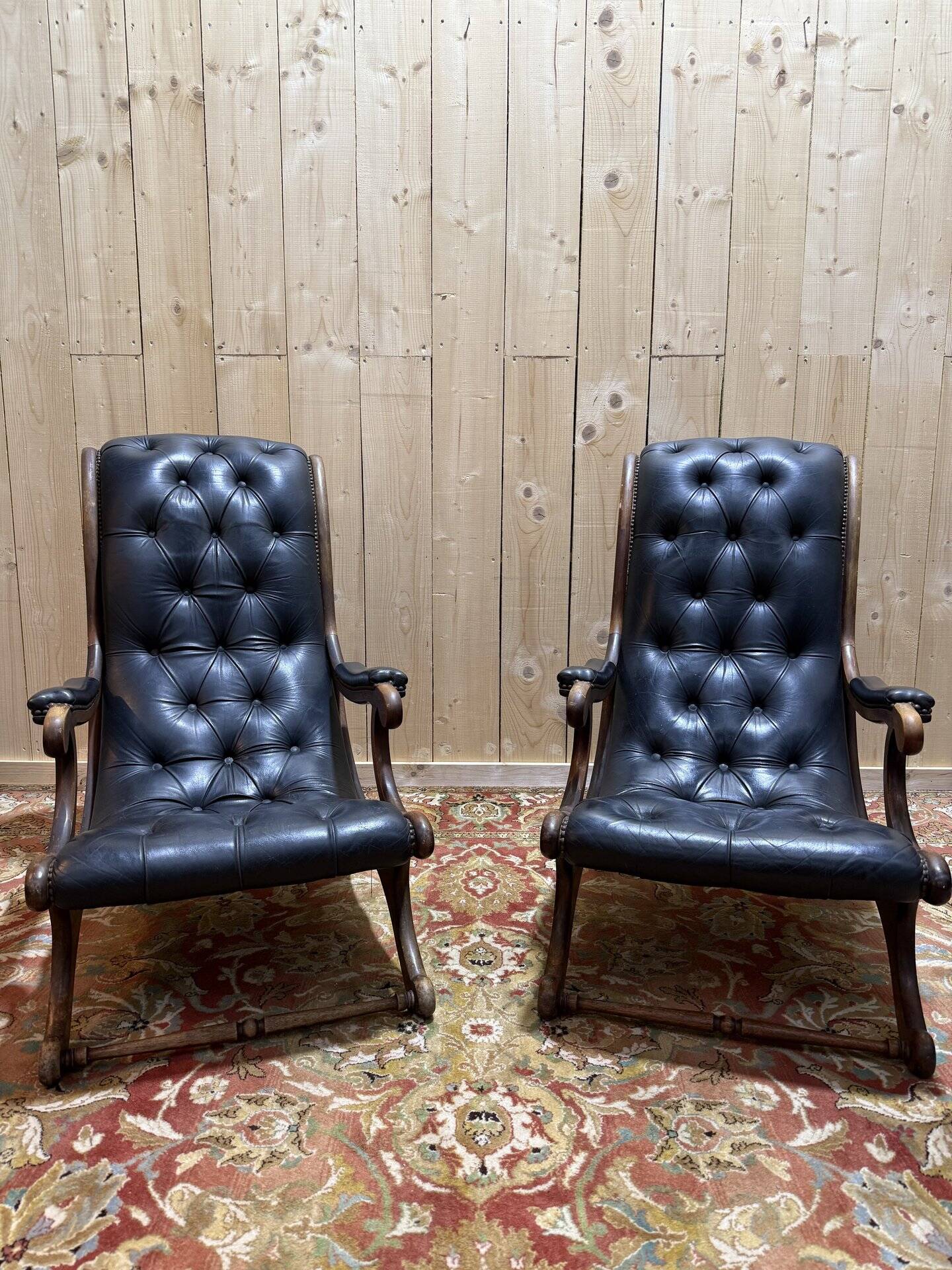 Pair of English Chesterfield armchairs in black leather