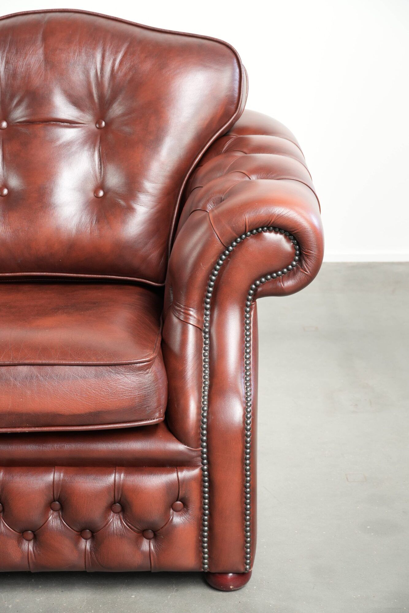 Brown cow leather Chesterfield armchair in a unique design