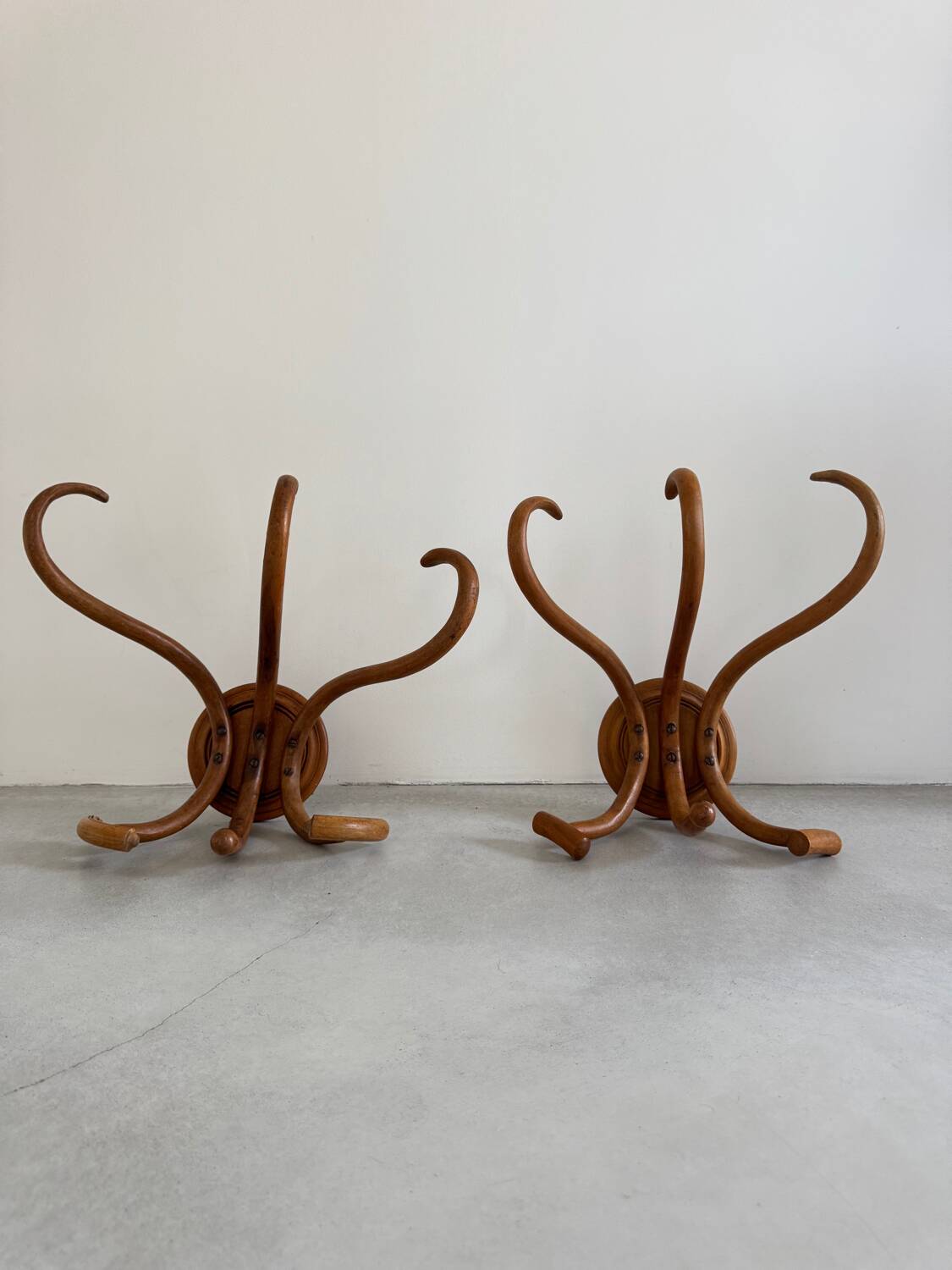 Pair of curved wooden coat racks or hooks from the 1900s