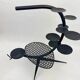 Candlestick sculpture in perforated iron clover motif