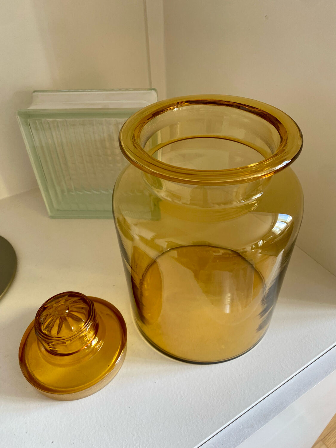 Old apothecary jar in blown amber glass
