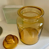 Old apothecary jar in blown amber glass
