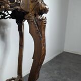 Carved selette with chimera decoration