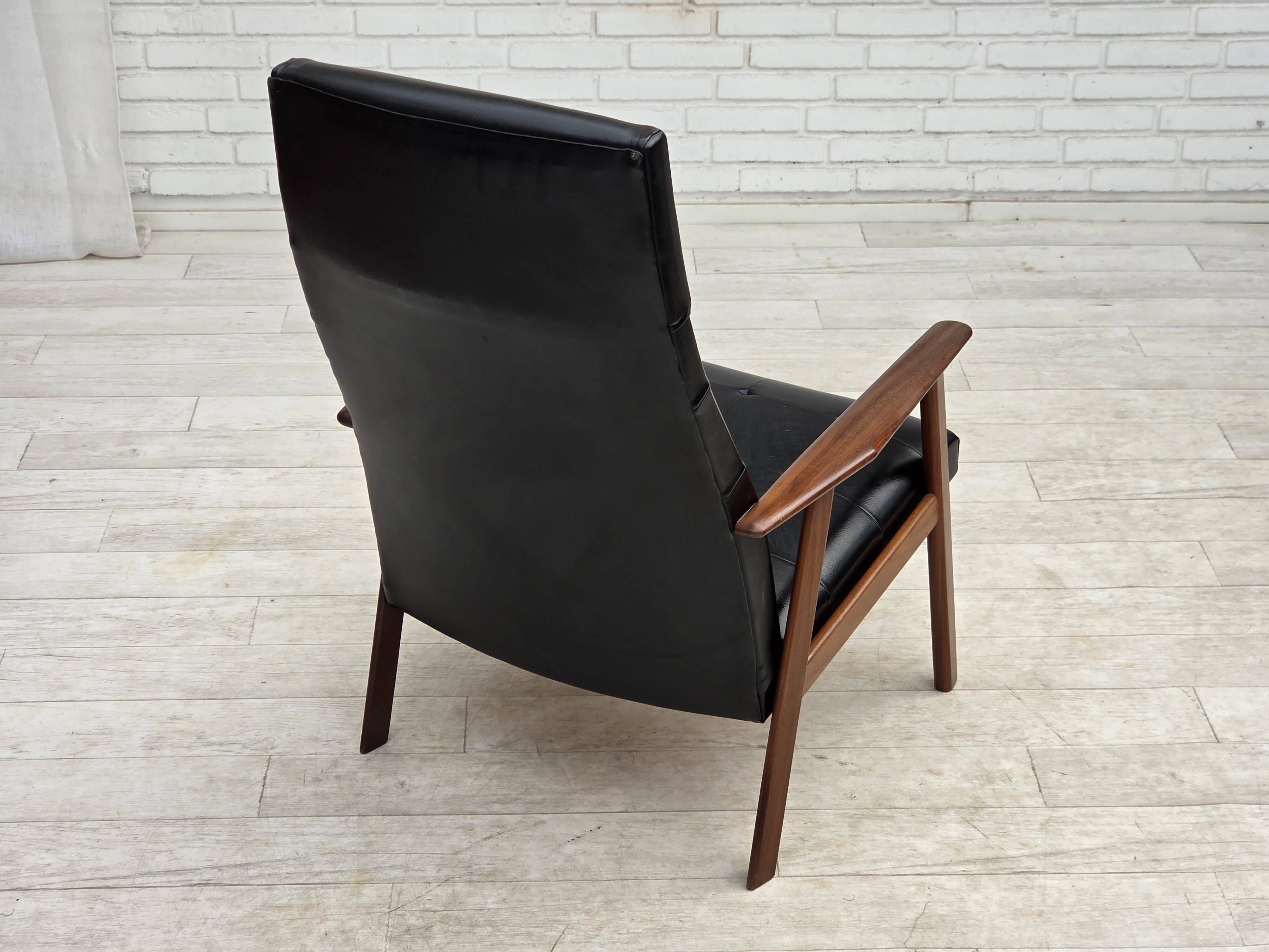 1970s, Danish armchair, black artificial leather, teak wood.