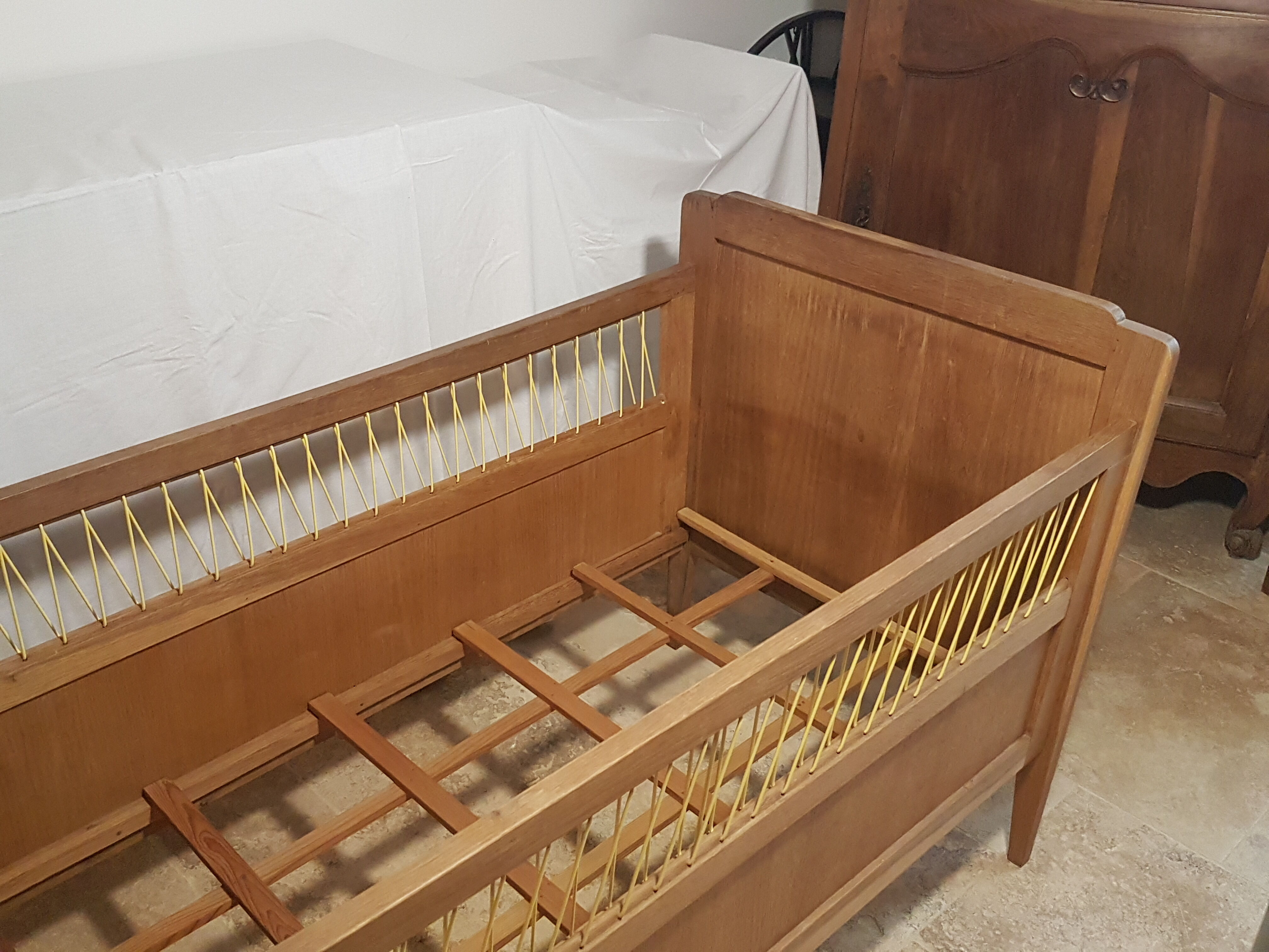 Children's bed made of wood and yellow scoubidou, 1950s.