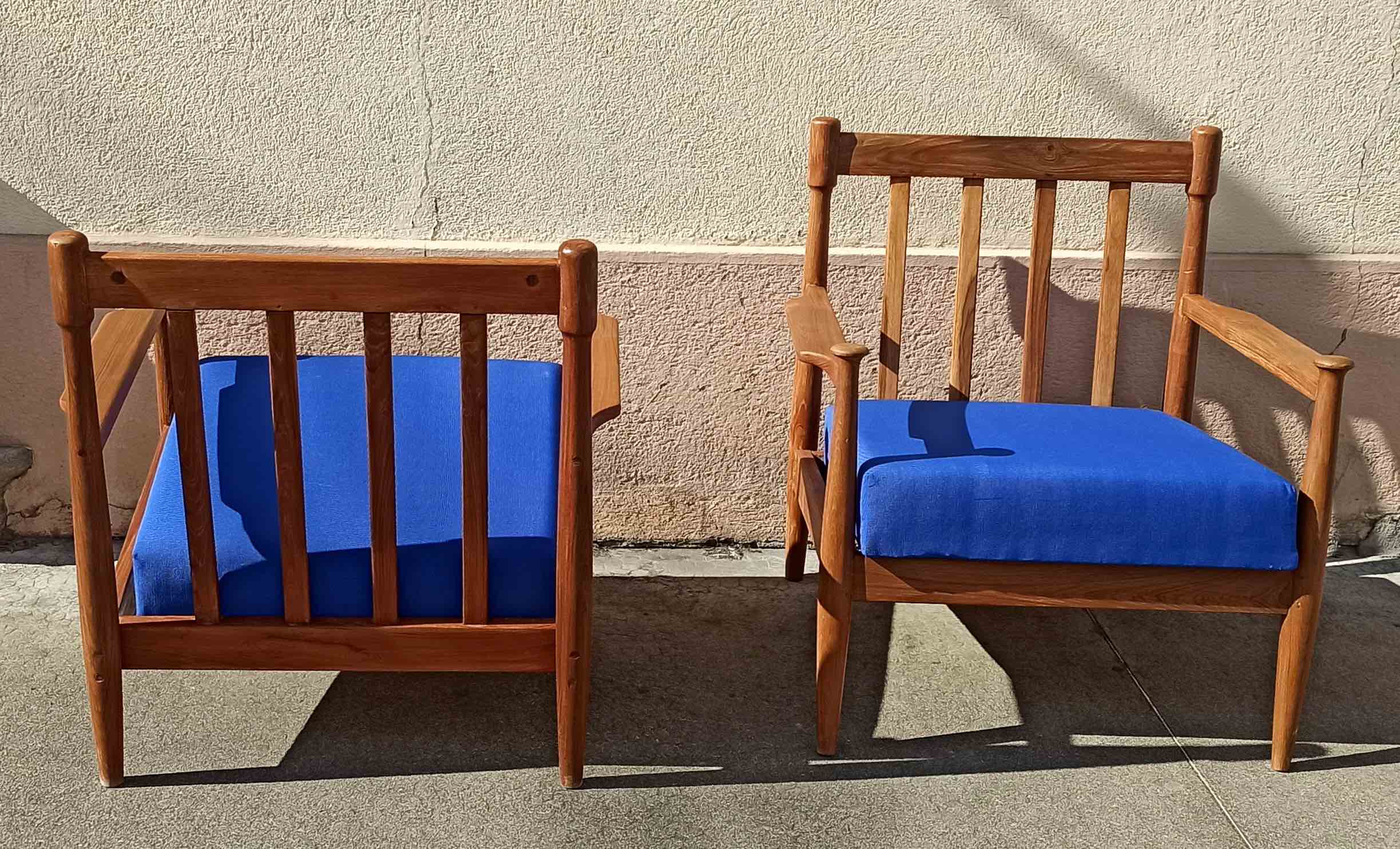 Pair of scandinavian armchairs in solid teak 50s