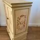 2-door flowered wooden cabinet