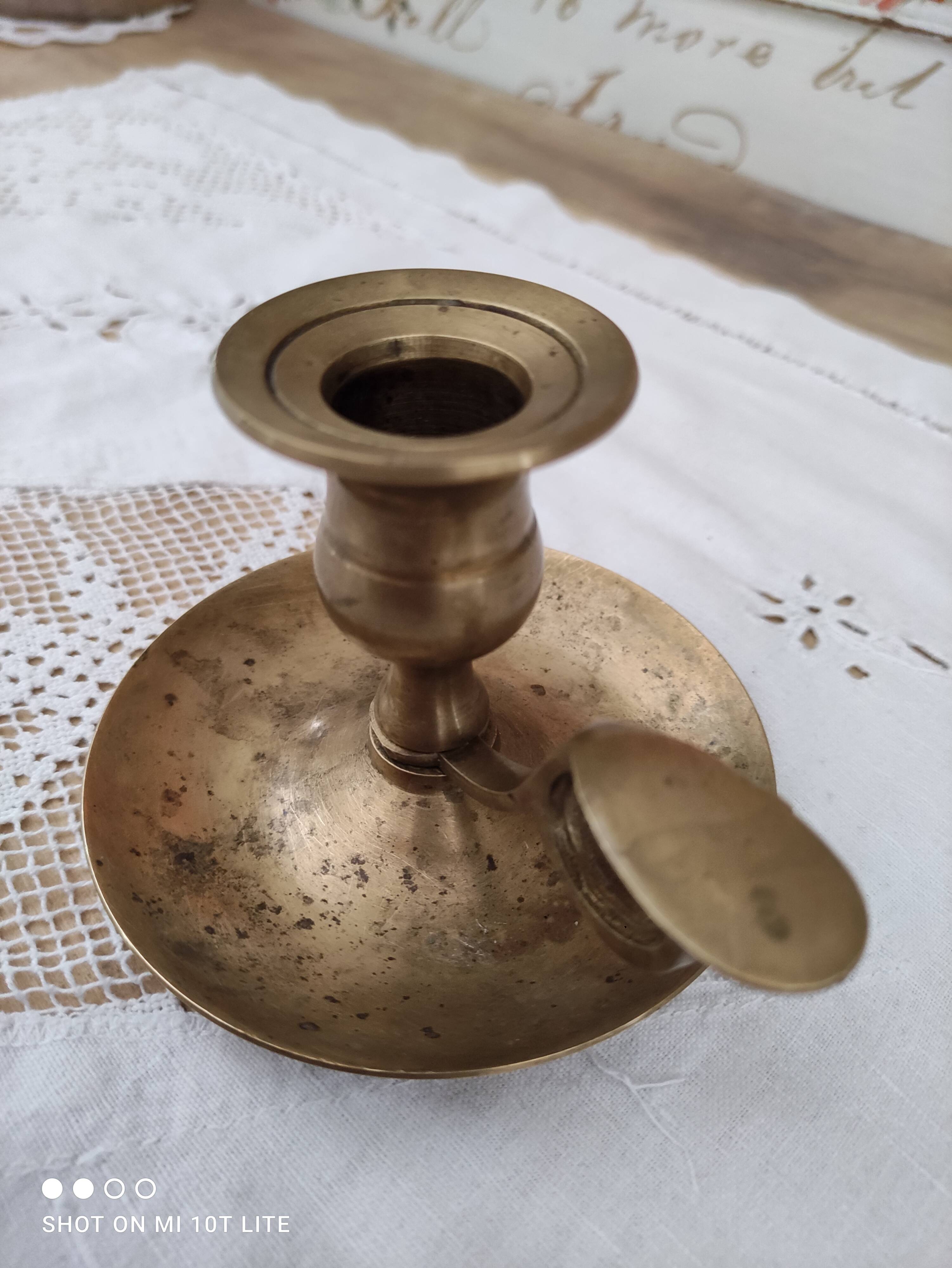 Hand candle holder called cellar rat in solid brass