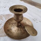 Hand candle holder called cellar rat in solid brass