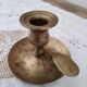 Hand candle holder called cellar rat in solid brass