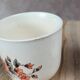 Set of 3 vintage ceramic cups with floral decoration.