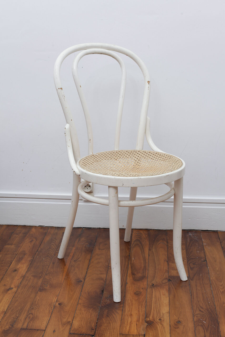White wooden chair with cannage