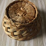 Vintage round wicker basket on stand