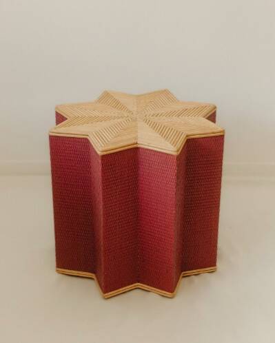 Small star-shaped side table in pink rattan