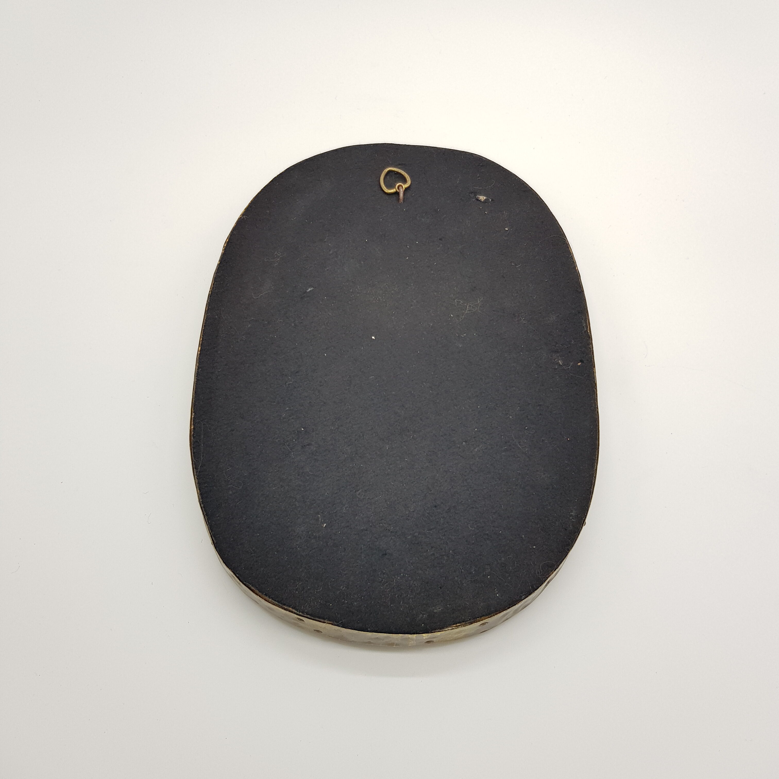 Brass oval mirror and blue cabochons