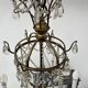 Louis XVI style chandelier with a pearl garland and painted tin, 20th century.