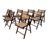Serie de 8 chaises pliantes vintage en bois et cannage 1960