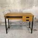 Vintage desk in modernist style made of wood.