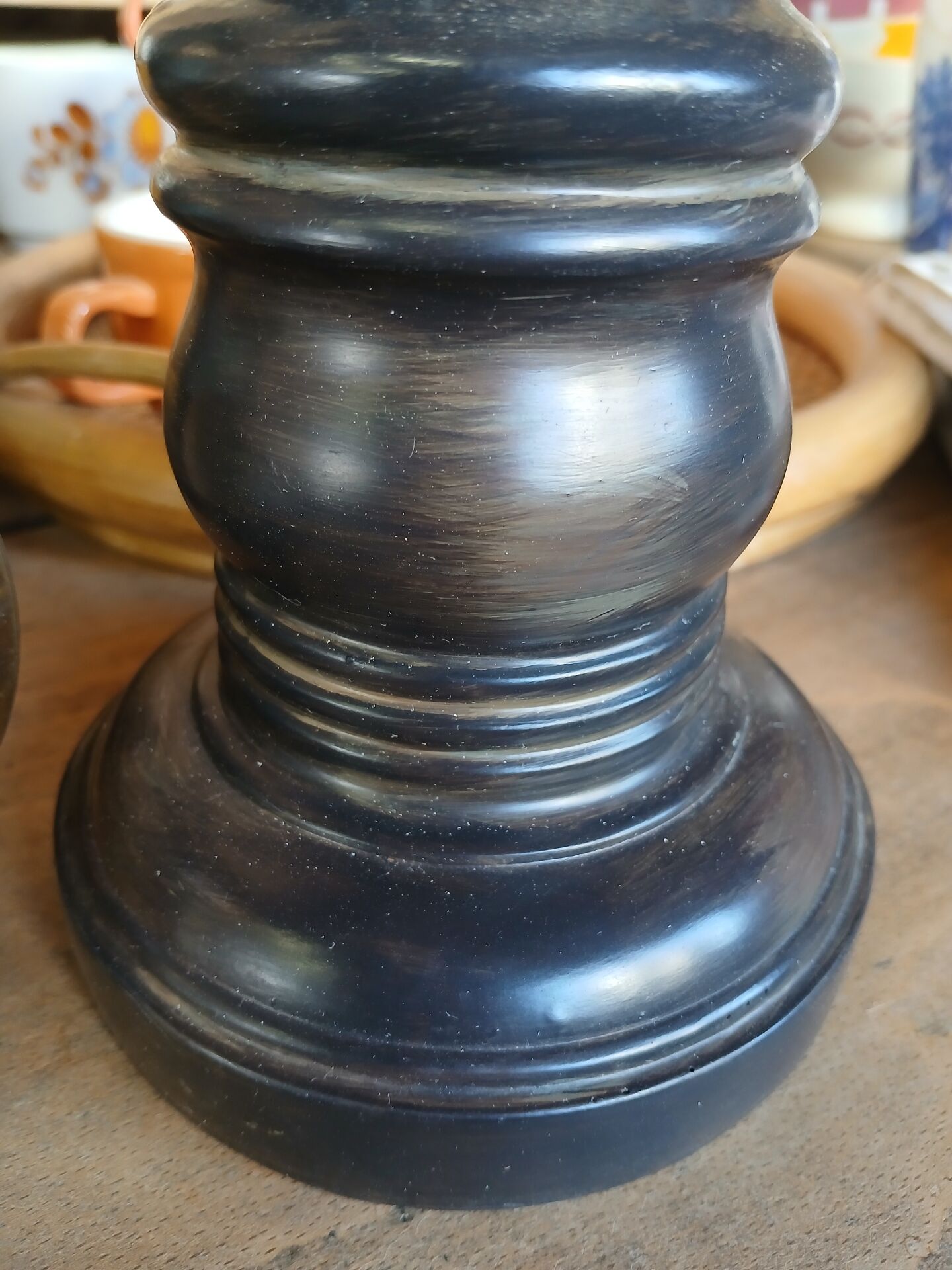2 carved wooden candlesticks