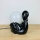 Black ceramic swan lamp with vintage opaline globe