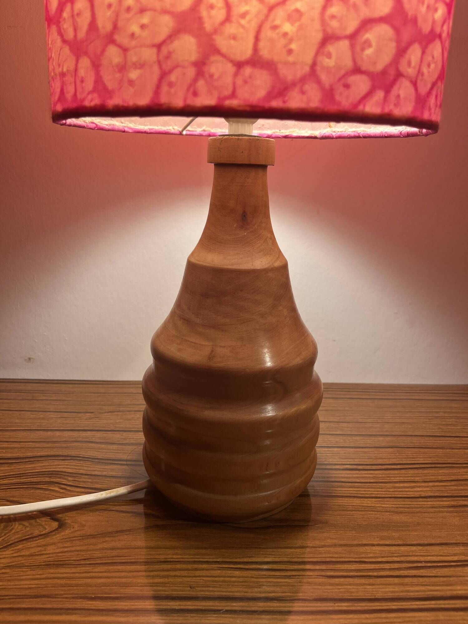 Vintage lamp with a carved wooden base from the 1970s.