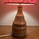 Vintage lamp with a carved wooden base from the 1970s.