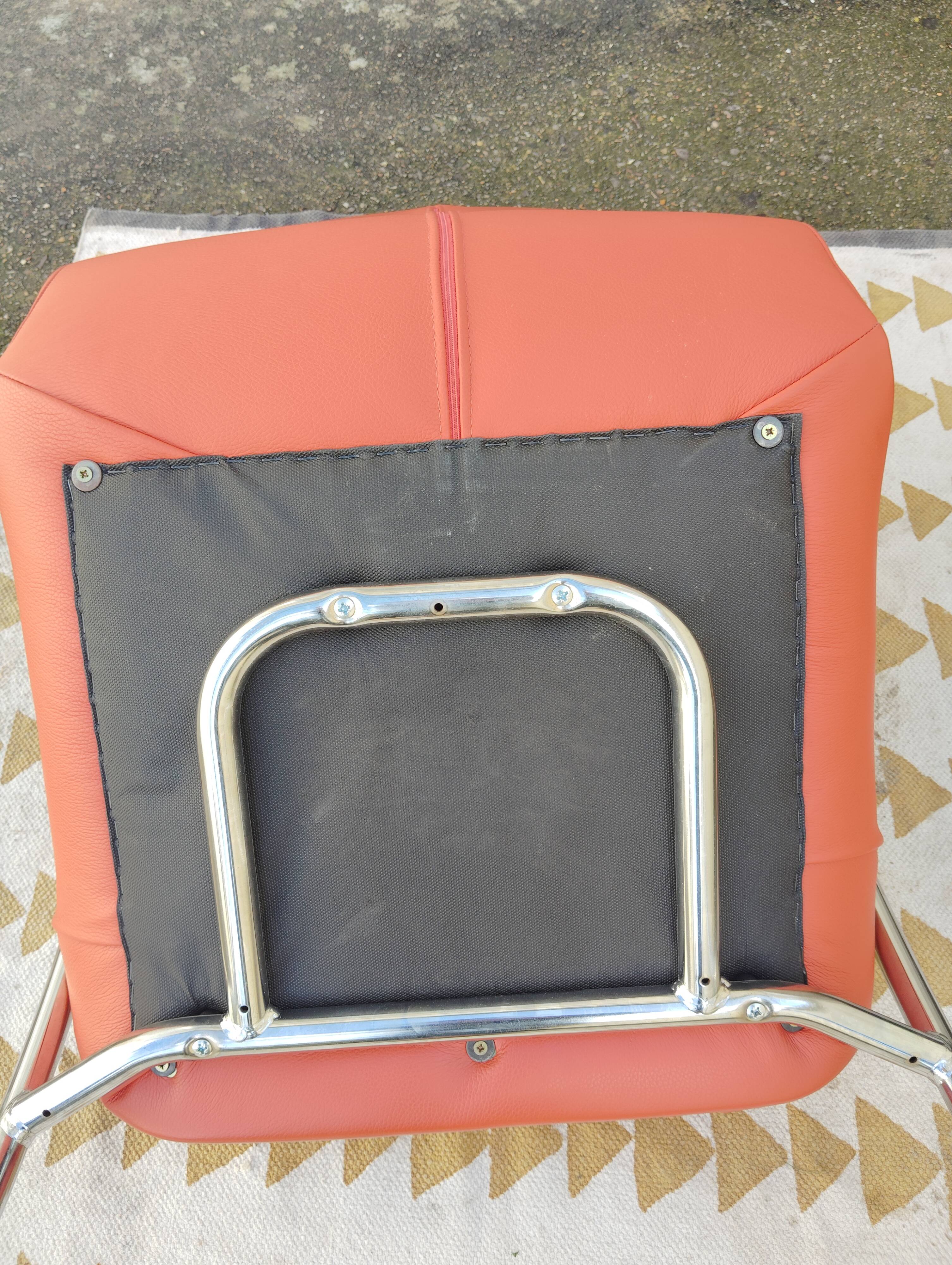 Orange leather cantilever tubular armchair