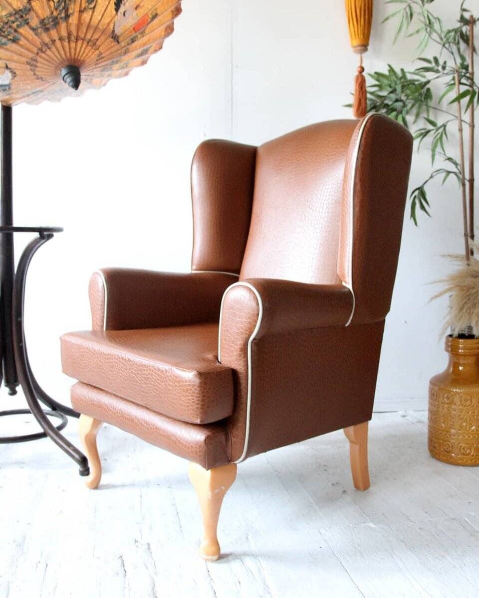 Vintage brown leatherette wingback armchair set, light wood legs, 1960s.