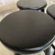 Set of three vintage stools in black lacquered wood.