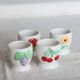 4 vintage Afibel porcelain egg cups - Barbotine decor
