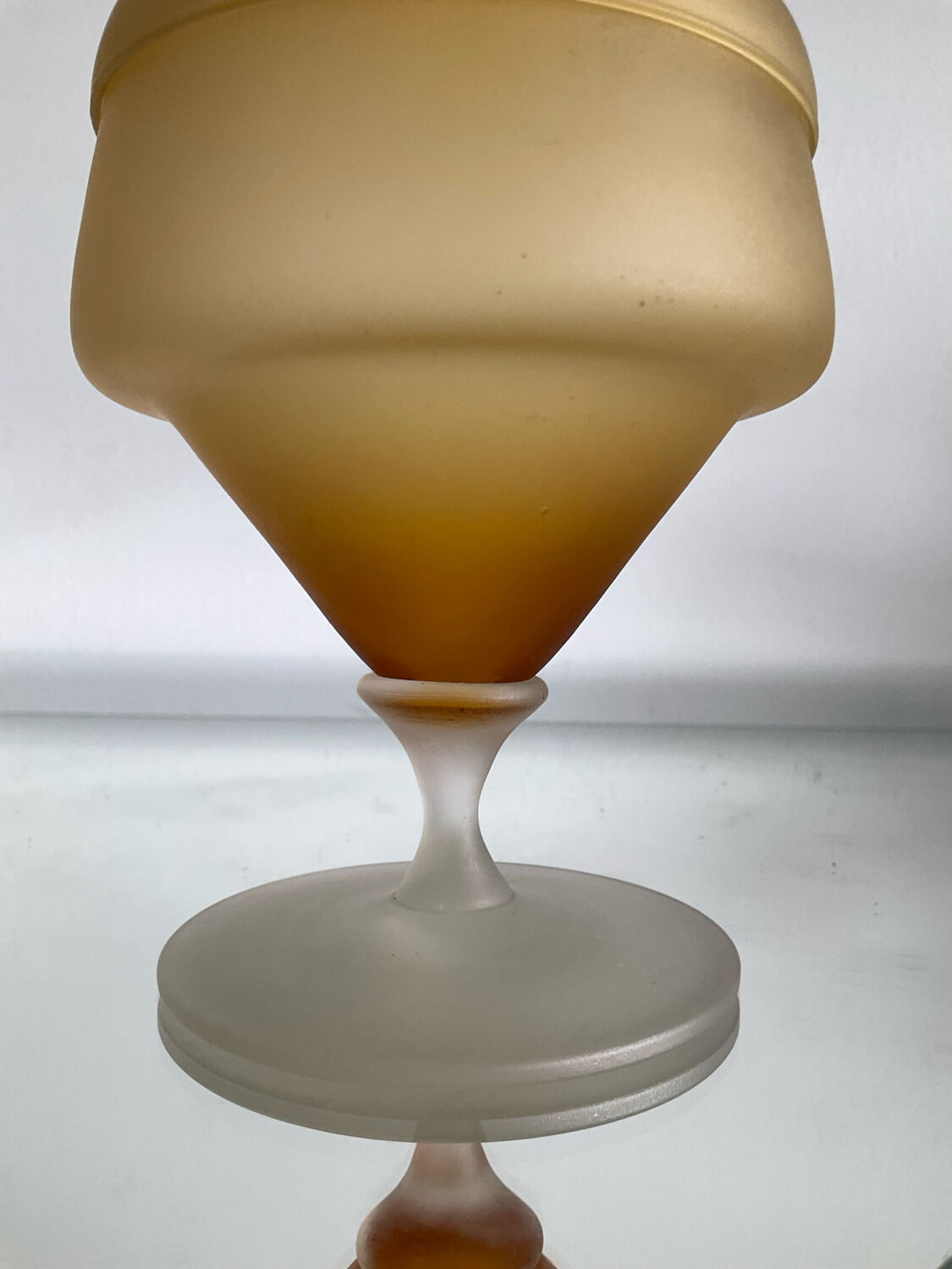 Vintage blown glass candy box on a stand