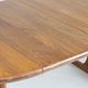 Table à manger ronde extensible vintage en teck massif des années 1960.