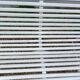 Old garden bench with metal legs and wooden slats