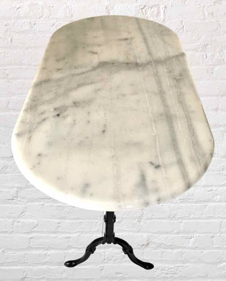 Oval marble and cast iron bistro table
