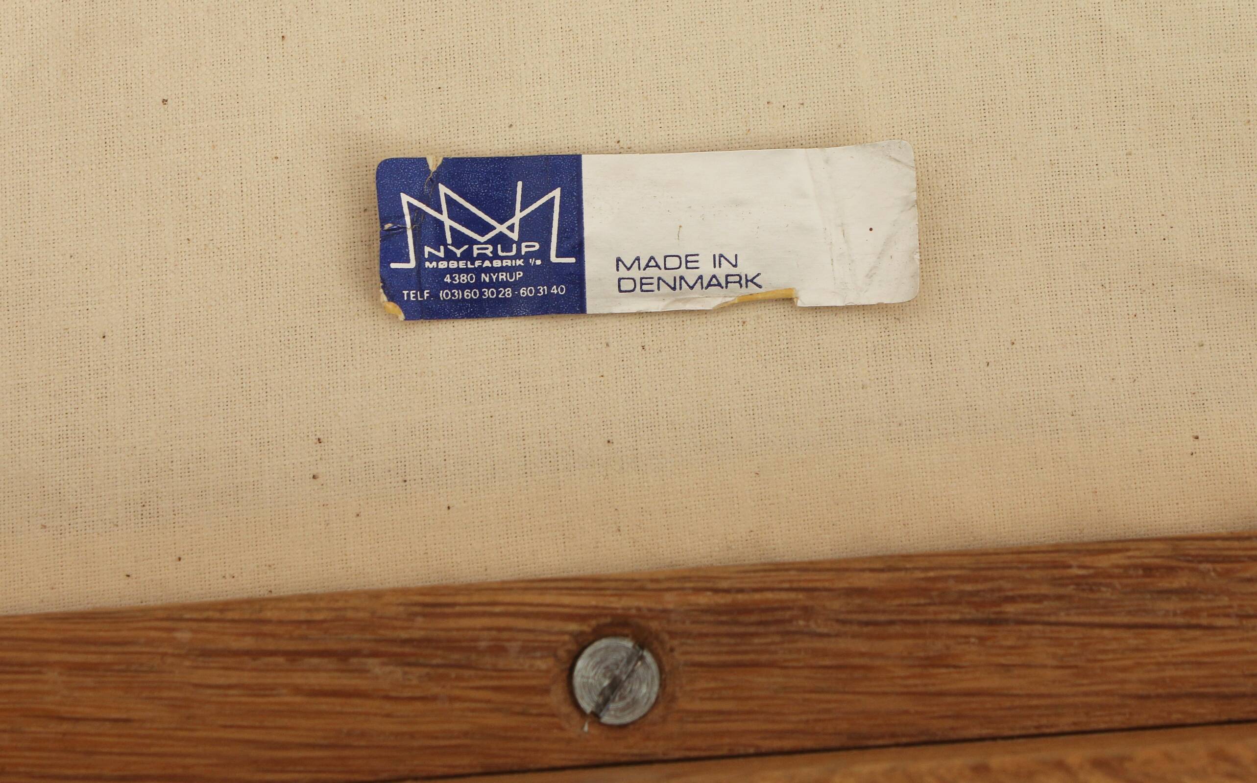 Four oak dining chairs by Henning Kjaernulf.