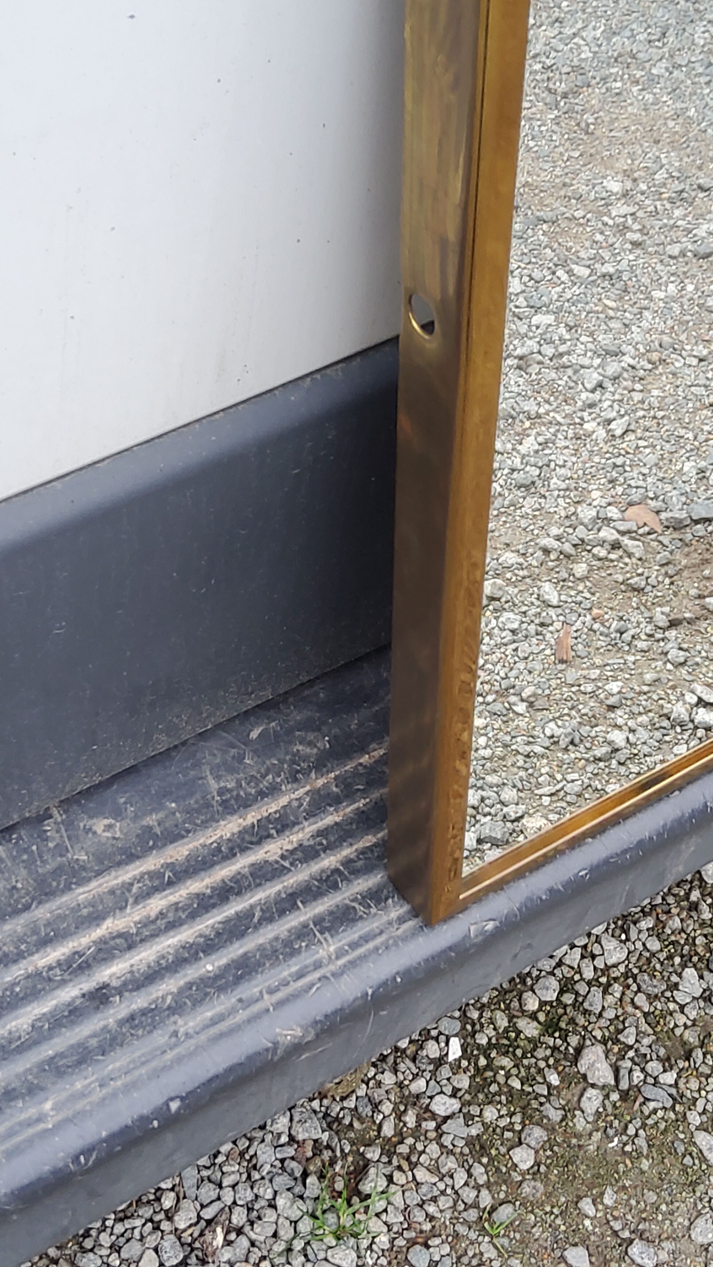 Mirror of the 70s in gilded metal, 60x35 cm