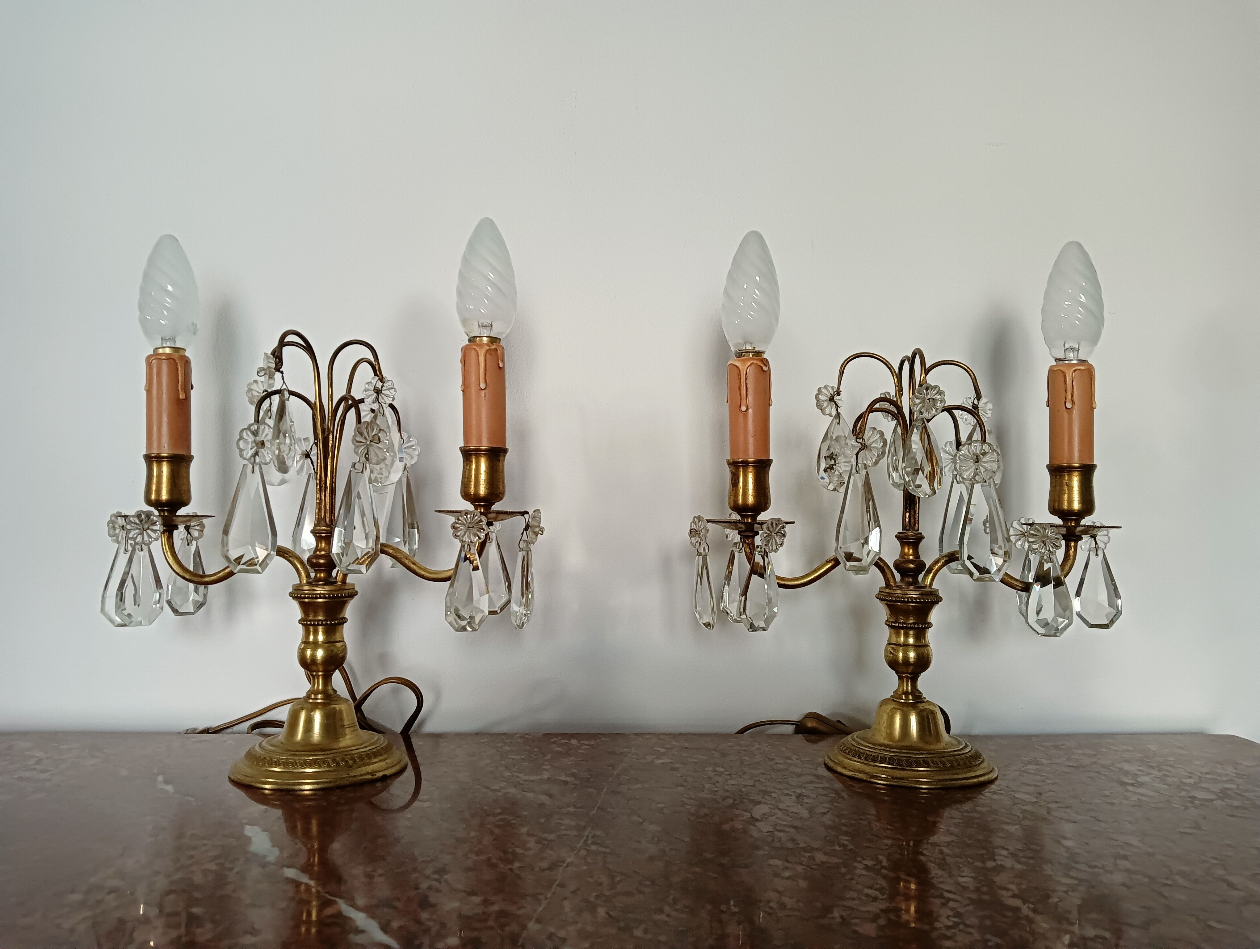 Pair of bronze girandoles with crystal pendants, two arms of lights.